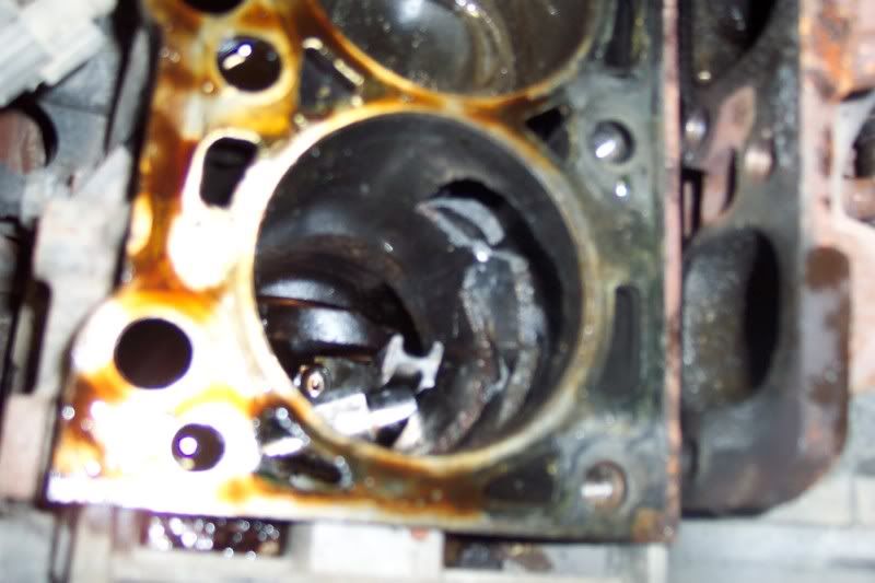 Here is the damage from the dropped valve seat Focus Fanatics Forum