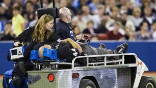 Home plate umpire Kerwin Danley is taken off the field and sent to hospital by paramedics after being hit by a bat.