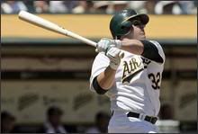 Jack Cust hit a grand slam Thursday, propelling Oakland to a 9-4 win over Texas.