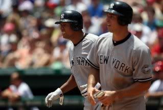 Alex Rodriguez and Mark Teixeira celebrate after scoring in the third inning.
