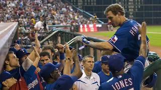 Josh Hamilton is greeted by his teammates after homering in the first inning.