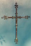 Cross made from copper wire.