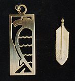 Saw-cut fabricated bird and feather pendants