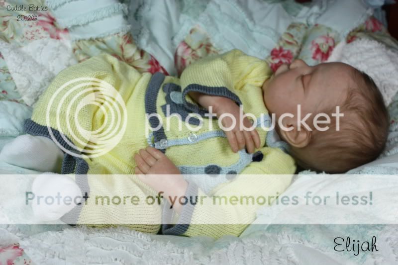 Elijah has hand rooted, wispy baby eyelashes in light brown to match 